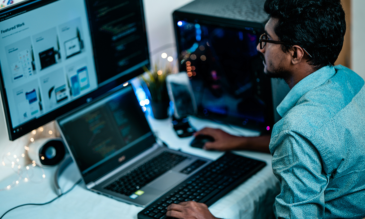 man sitting at desktop computer firosnv photography unsplash