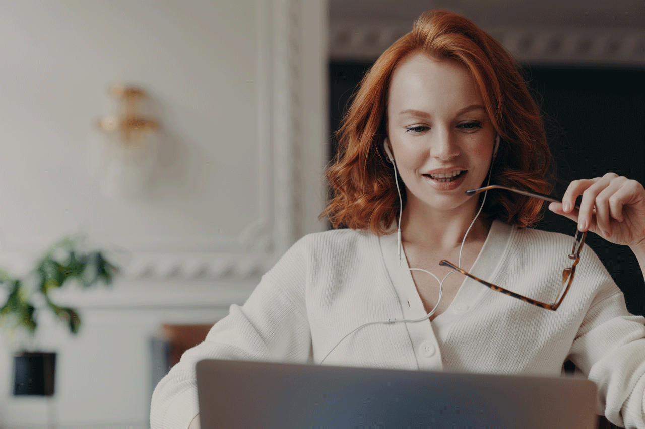 International professional woman reviewing application on laptop